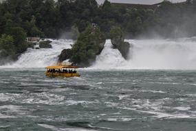 tourists at waterfalls on the rhine