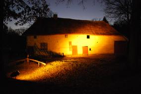 Evening and a lighted house