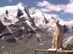 Beautiful landscape with the statue near the snowy GroÃglockner in Austria