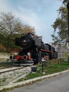 Old Black locomotive on rails