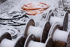 Snowy cable drums on site