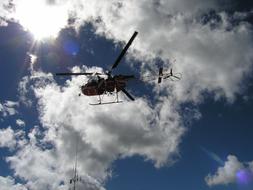 Helicopter Rescue in the sky in the bright sun