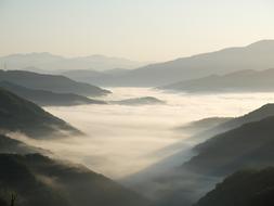Beautiful landscape of the mountains in fog, in colorful and beautiful light