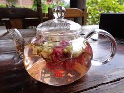 transparent teapot with flowers