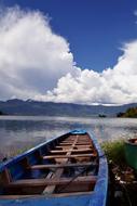 blue fishing boat on Lake Maninjau, Indonesia