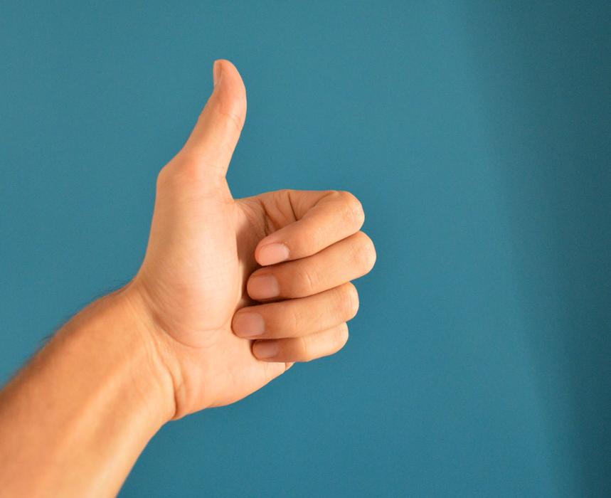 thumbs up on blue background