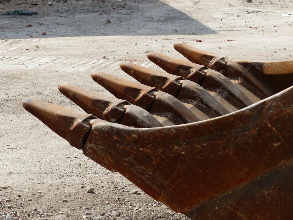 excavator bucket on the sand
