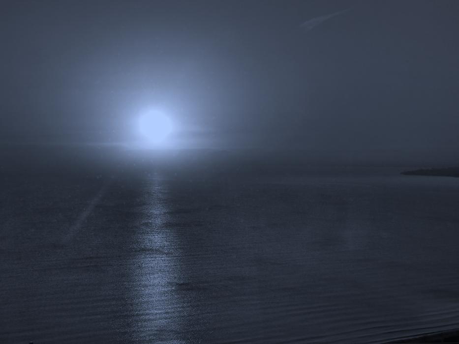 bright moon on the sea horizon at night