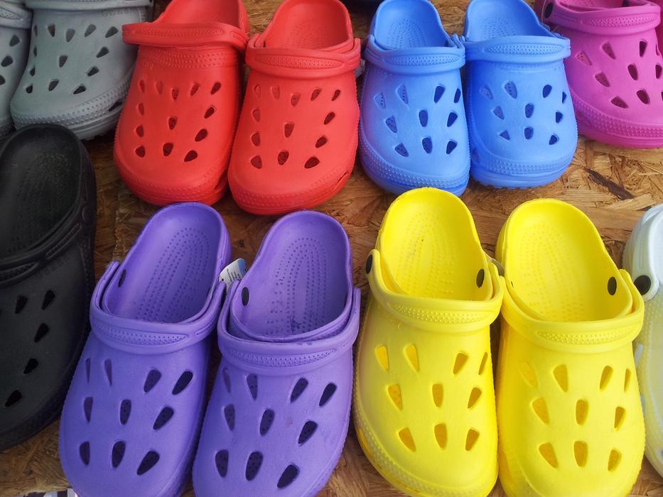 Close-up of the colorful pairs of garden shoes