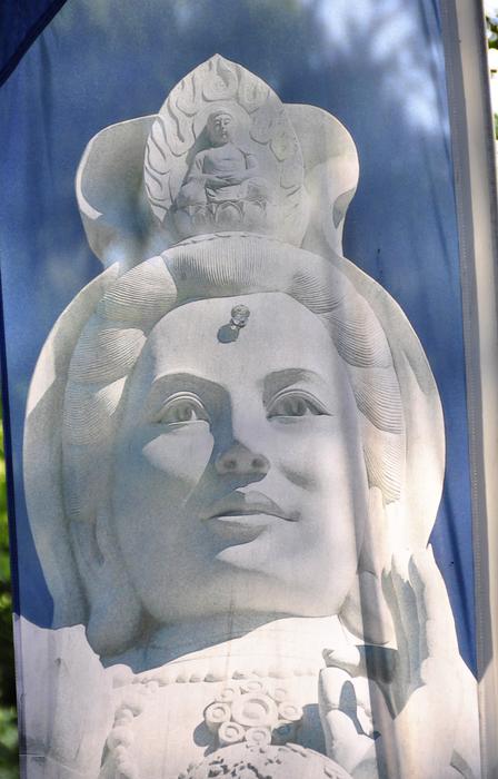 White statue of the woman, on the flag