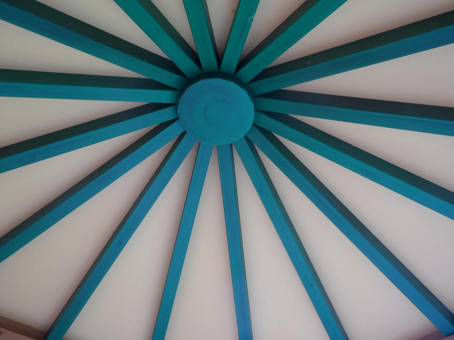 Close-up of the blue and white roof construction with colored bars