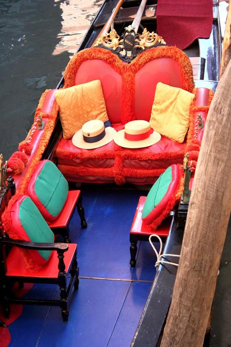 bright chairs, hats and pillows on the gondola