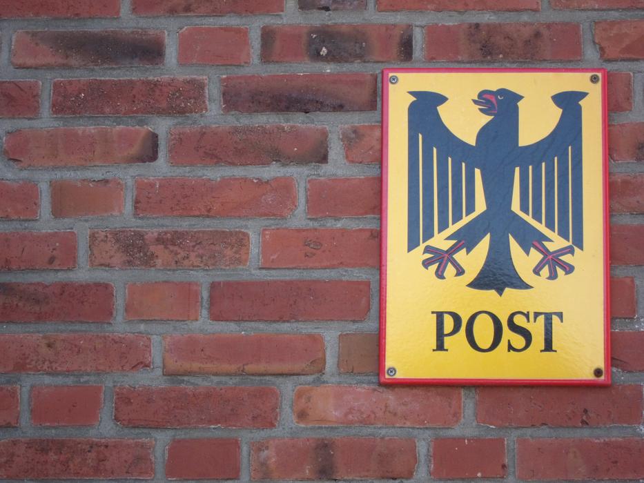 Shield Post on a brick wall close-up