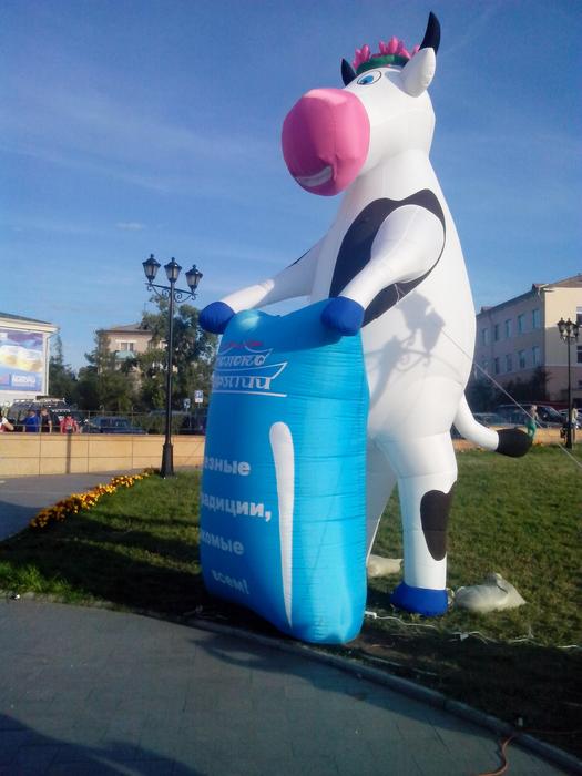 inflatable cow figure with bag