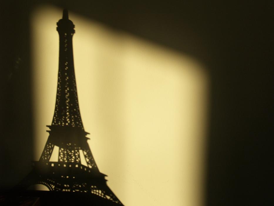Shadow of the Eiffel Tower in Paris, France, in light, among the shadows