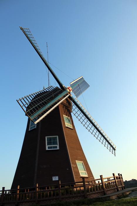 Beautiful landscape with the windmill, at beautiful and colorful sky