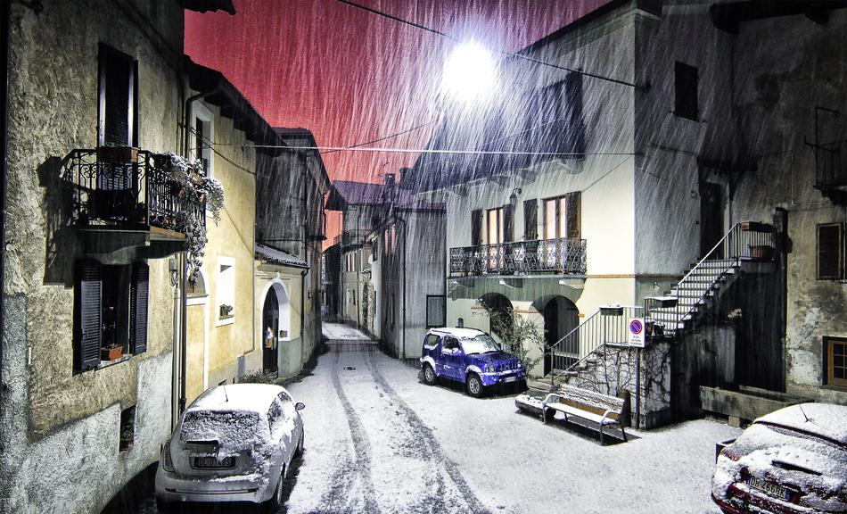 Beautiful landscape of the street with cars, in snow, in Montestrutto, Piemonte, Italy