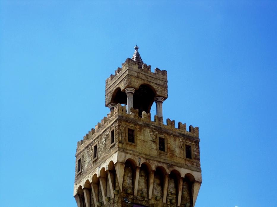 jagged tower against the blue sky