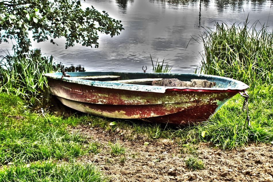 rusty rowboat on the shore
