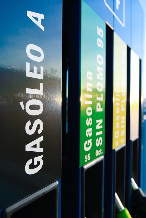Close-up of the colorful signs in light, at the petrol station