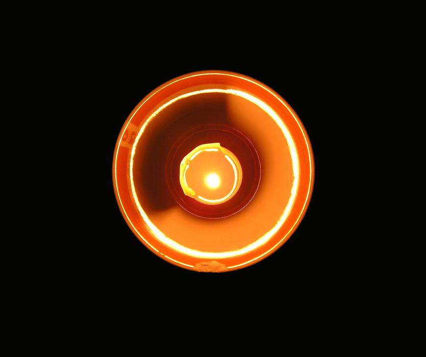 Top view of the colorful candle holder, at black background