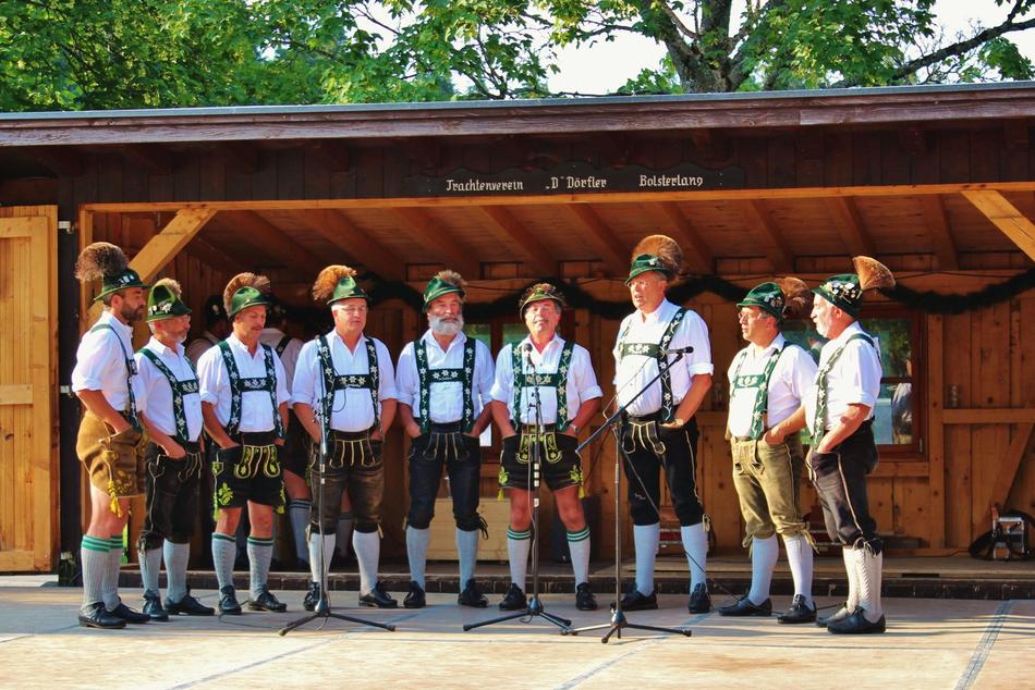 performance of men on stage in bavaria