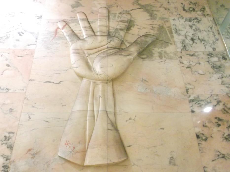 relief of hands on the wall at the metro station in Lisbon