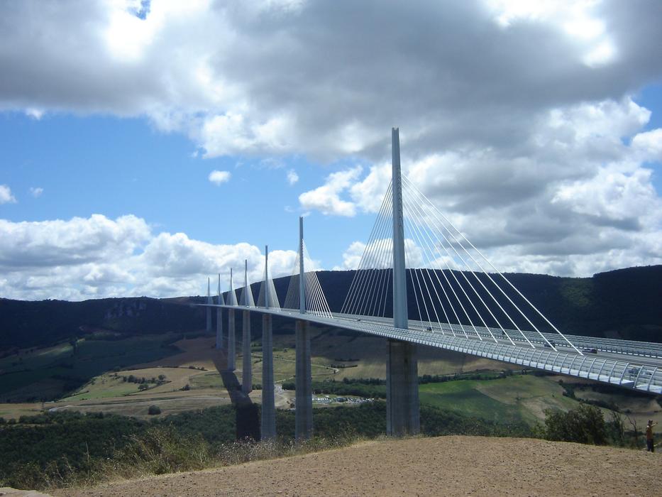 Landscape with the bridge, among the mountains with plants, in Millau, France, under the clouds