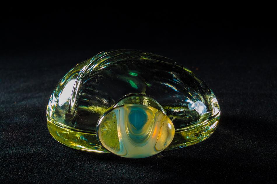 Perfume in Glass Bottle at dark background