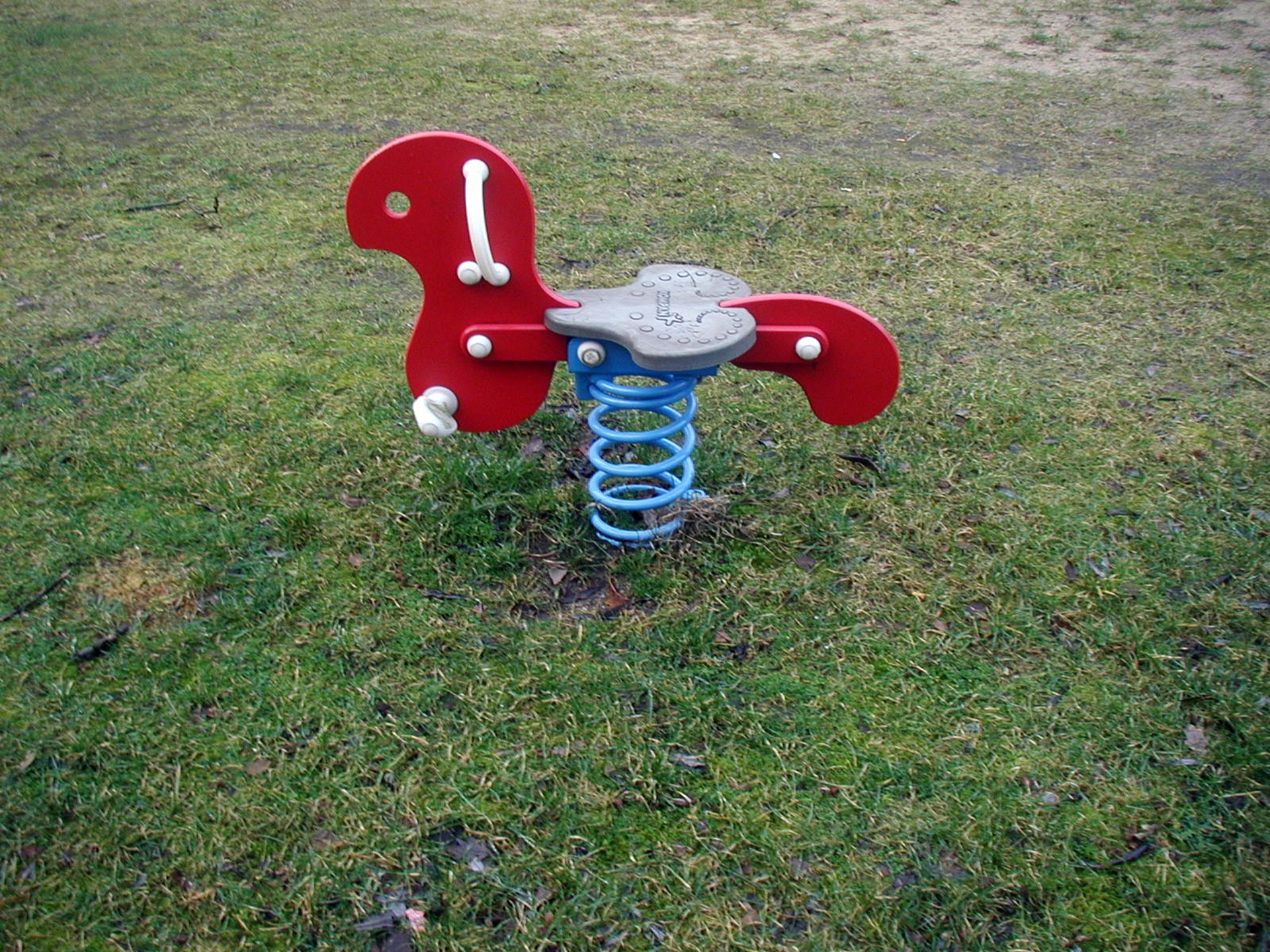 Red rocking horse on the playground free image download