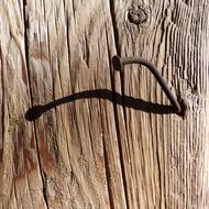 Nail in Wood Shadow