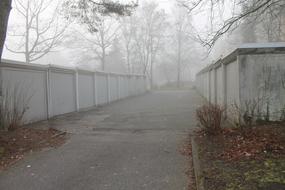 fog on the road along the garages