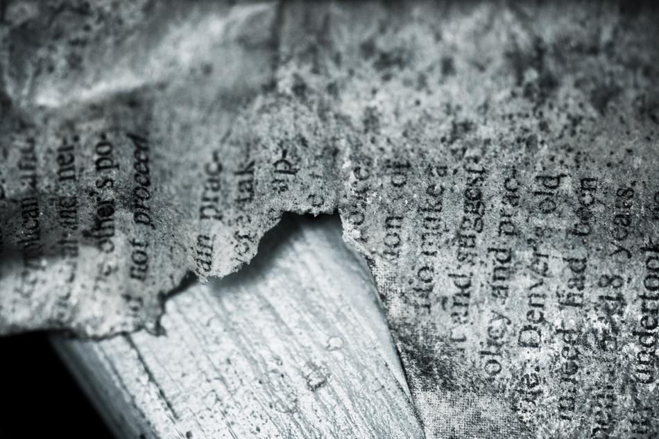 black and white, old torn newspaper