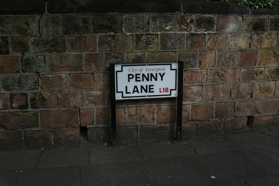 Penny Lane Plate Sign near stone wall