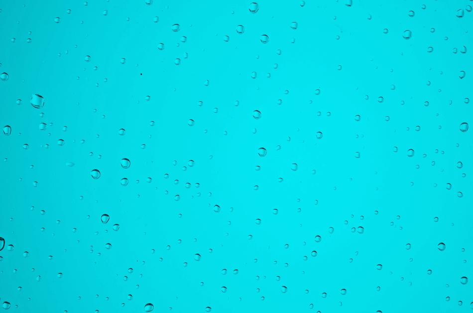 Drop Of Water on turquoise background