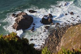 sea, cliff and stones