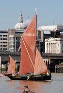 tate & lyle Sailing boat on Thames River at city, uk, england, london