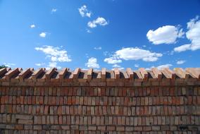 brick wall, sky, white clouds