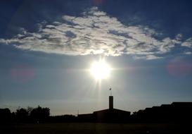 Sunrise Against Light Clouds In