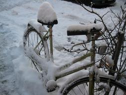 old bike under white snow