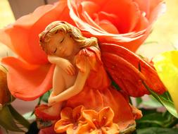 female Elf Dreaming, figurine among flowers
