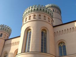 the facade of the palace against the blue sky