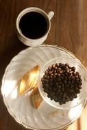 cup of hot coffee and beans