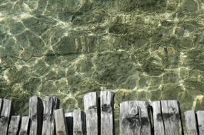 wooden bridge, lake with clear water