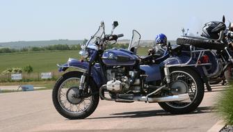 vintage bmw motorcycle with Sidecar parked in countryside