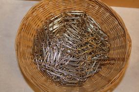 old rusty metal Paperclips in weaved Basket