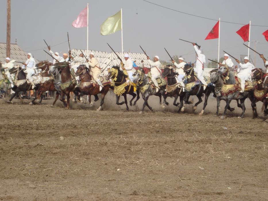 Riders on horseback with weapons