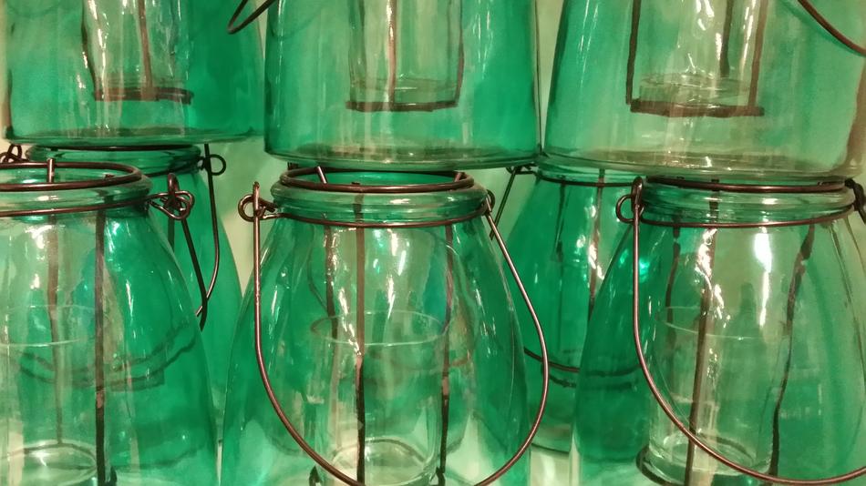 Glass pots at Green background