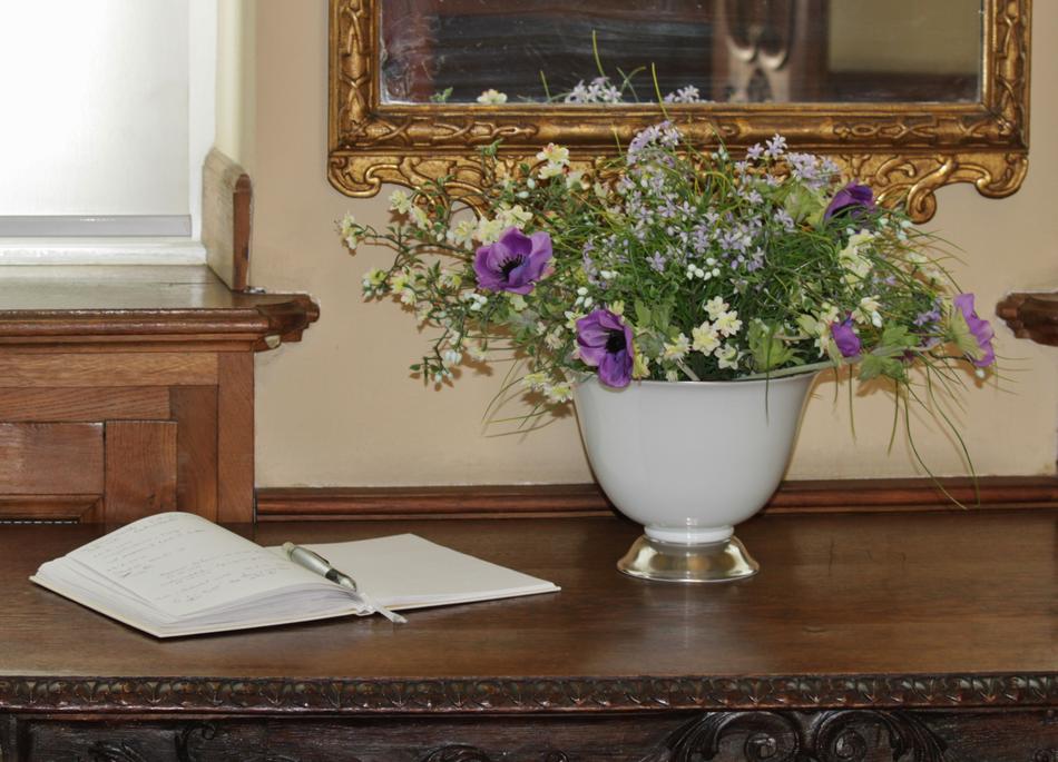 bouquet near the guest book in antique decor