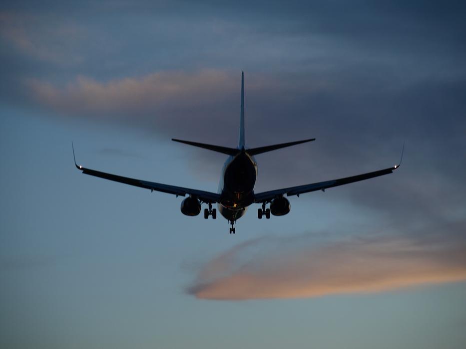 Arrival Plane Landing at sunset